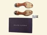 the shoes are next to a book and a pair of shoes