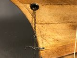 a wooden boat with a rope on the side of it