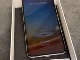 an iphone is sitting in a box on a table with a price tag on it