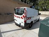 a white van that is parked on the side of the road