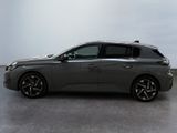 the grey car is parked on the concrete floor in the room