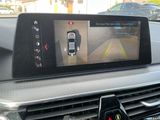 a picture of a car ' s rear view mirror with a car in the background
