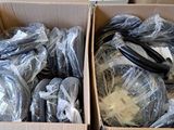 two boxes filled with different types of electronics in them