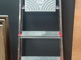 a ladder that is sitting next to a box