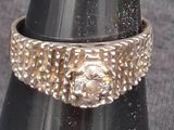 a close up of a ring on top of a cone