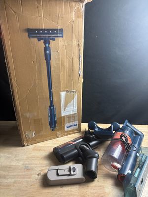 a box with a razor, a razor blade, and other items on a table