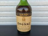 a close up of a bottle of cognac on a table