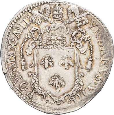a silver coin with a coat of arms on it