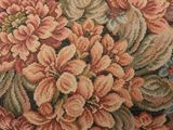 a close up of a tapestry with a bunch of flowers on it