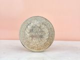 an image of a silver coin on a table