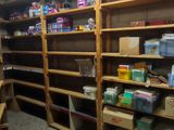 a room with a lot of shelves and a lot of boxes