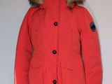 an image of a red parka with a hood and fur on it