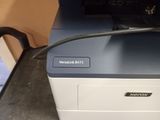 an image of a photo of a printer on a desk