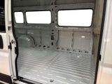 a white van with the door open and the interior of it