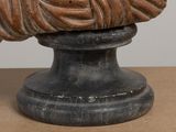 a statue of a woman sitting on top of a table