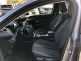 the interior of a car with black leather seats and a steering wheel