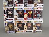a bunch of pop vinyl figures in a display case