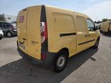 the back of a yellow van parked in a parking lot