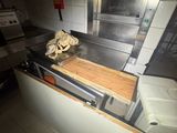 a kitchen with a stove, sink, and oven in it
