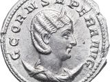 a silver coin with a woman ' s head and a crown on it