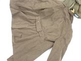 a pair of pants and a jacket laying on the floor