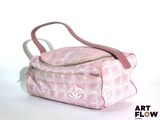 a pink bag with a handle on a white background