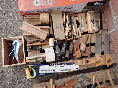 a box full of tools sitting on a pallet