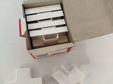 a cardboard box with several pieces of paper inside of it