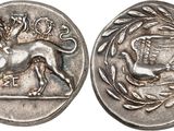 a silver coin with an image of a lion on it