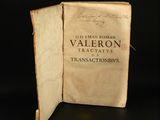an old book with writing on it sitting on top of a table