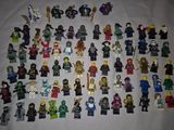 a lot of lego minifigs that are on a table