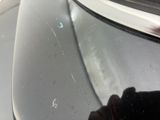 a dog that is looking out of the window of a car