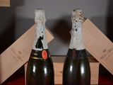 two bottles of champagne that are sitting on a table