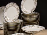 a lot of plates that are sitting on a table