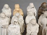 a lot of statues that are sitting on a table