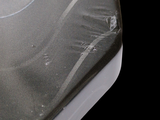 a close up of a cell phone on a black surface