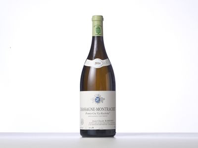 the bottle of wine is sitting on the table with a white background