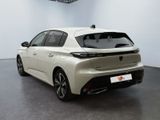 the rear view of a white car in a showroom