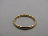 a close up of a gold ring with the word ' be strong ' engraved on it