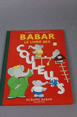 a red book with a picture of a couple of mice on it