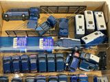 a lot of toy cars and trucks in a box