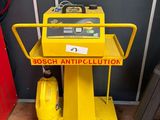 the yellow cart is sitting on the floor next to the door