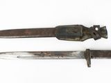 two old knives on a white surface next to each other