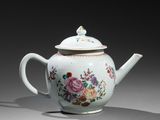 teapot decorated with flowers and birds on a grey background