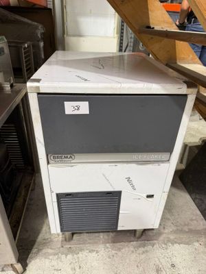 a small ice machine sitting on top of a counter
