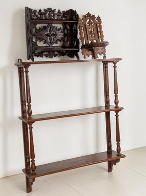 a wooden shelf with a mirror on top of it