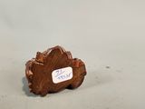 a small piece of wood with a sticker on it