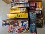 a lot of different toys and games on the floor