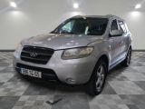 a picture of a silver suv parked in a garage