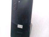 the back of a black samsung galaxy note 10 lite on a white surface